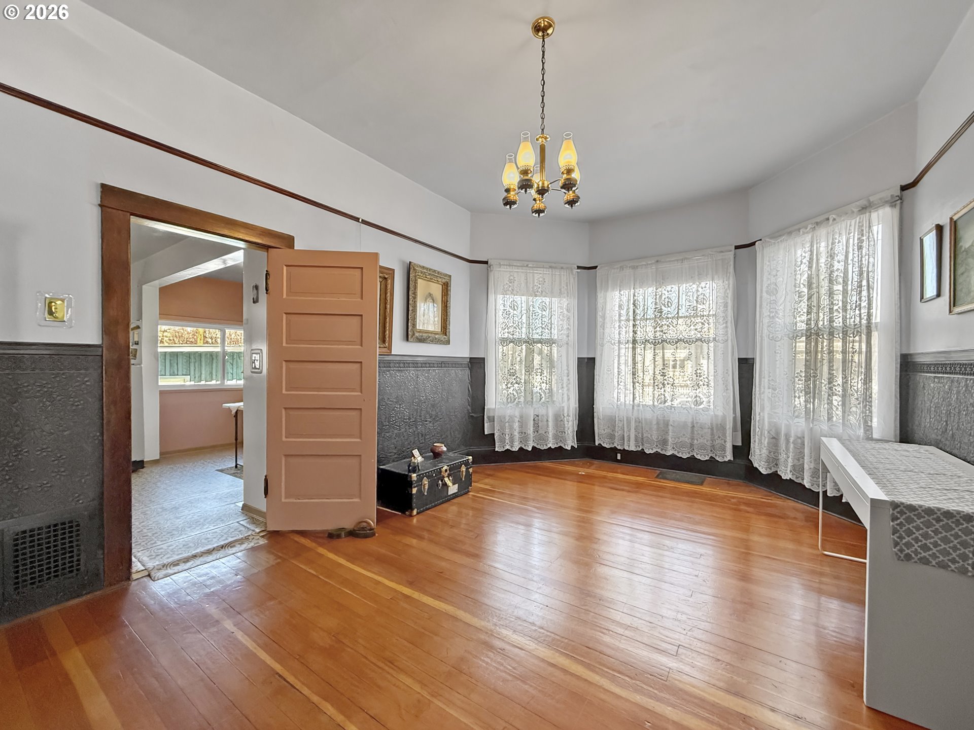 2291 2nd Street Baker City, OR 97814 - Photo 12 of 48 a view of an empty room with a window and wooden floor