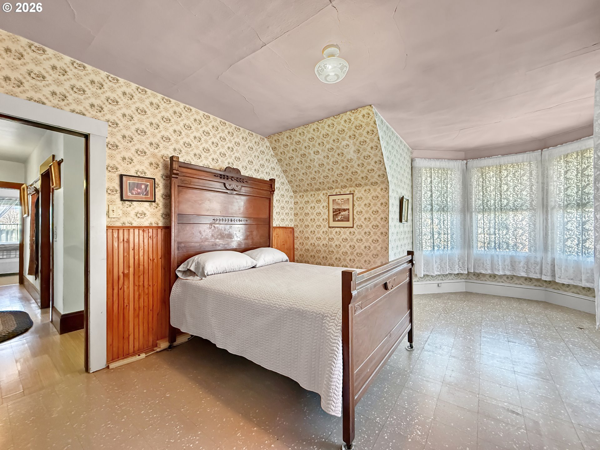 2291 2nd Street Baker City, OR 97814 - Photo 25 of 48 a spacious bedroom with a bed and a large window