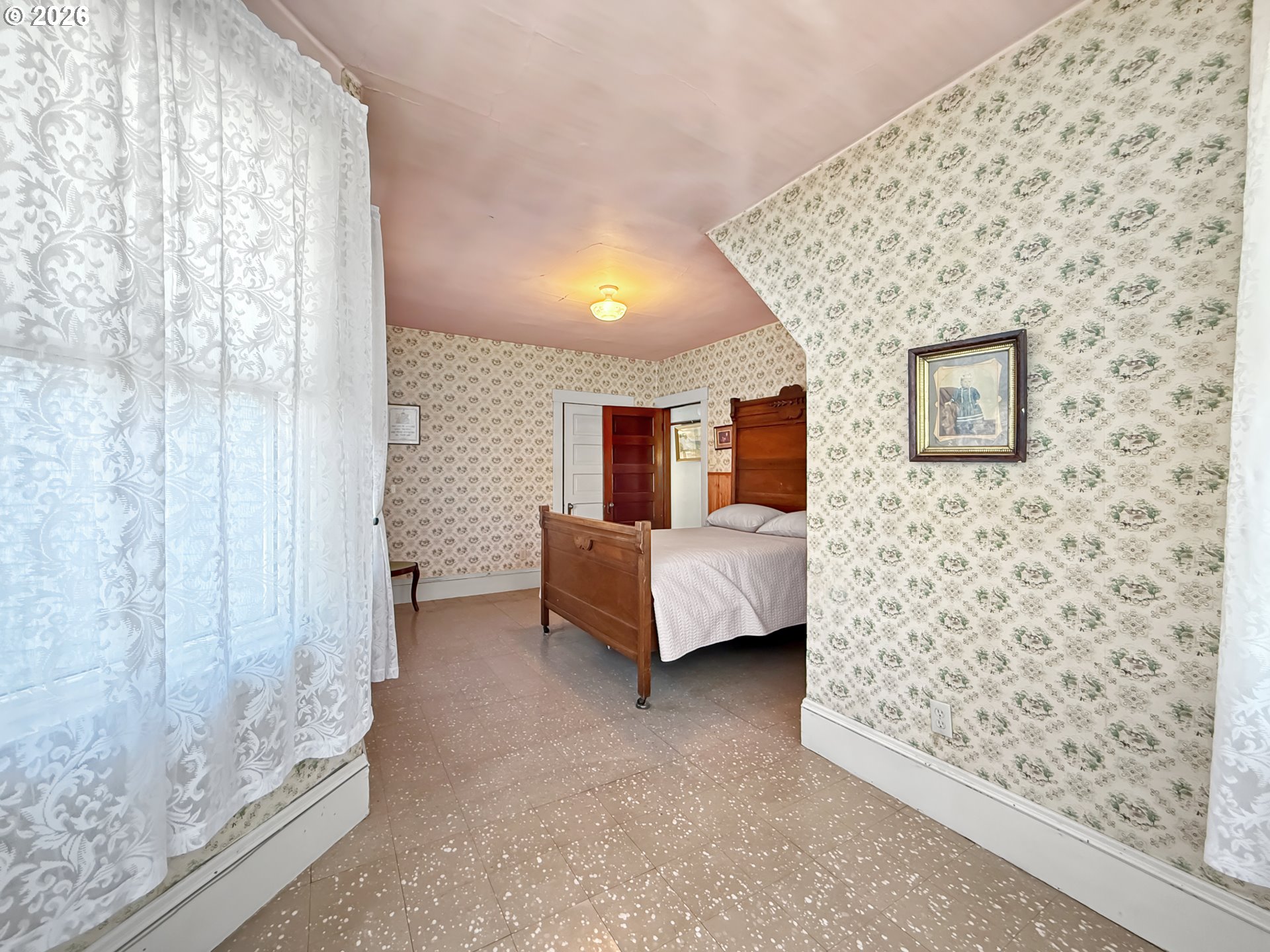 2291 2nd Street Baker City, OR 97814 - Photo 27 of 48 a bedroom with a bed and a wall painting