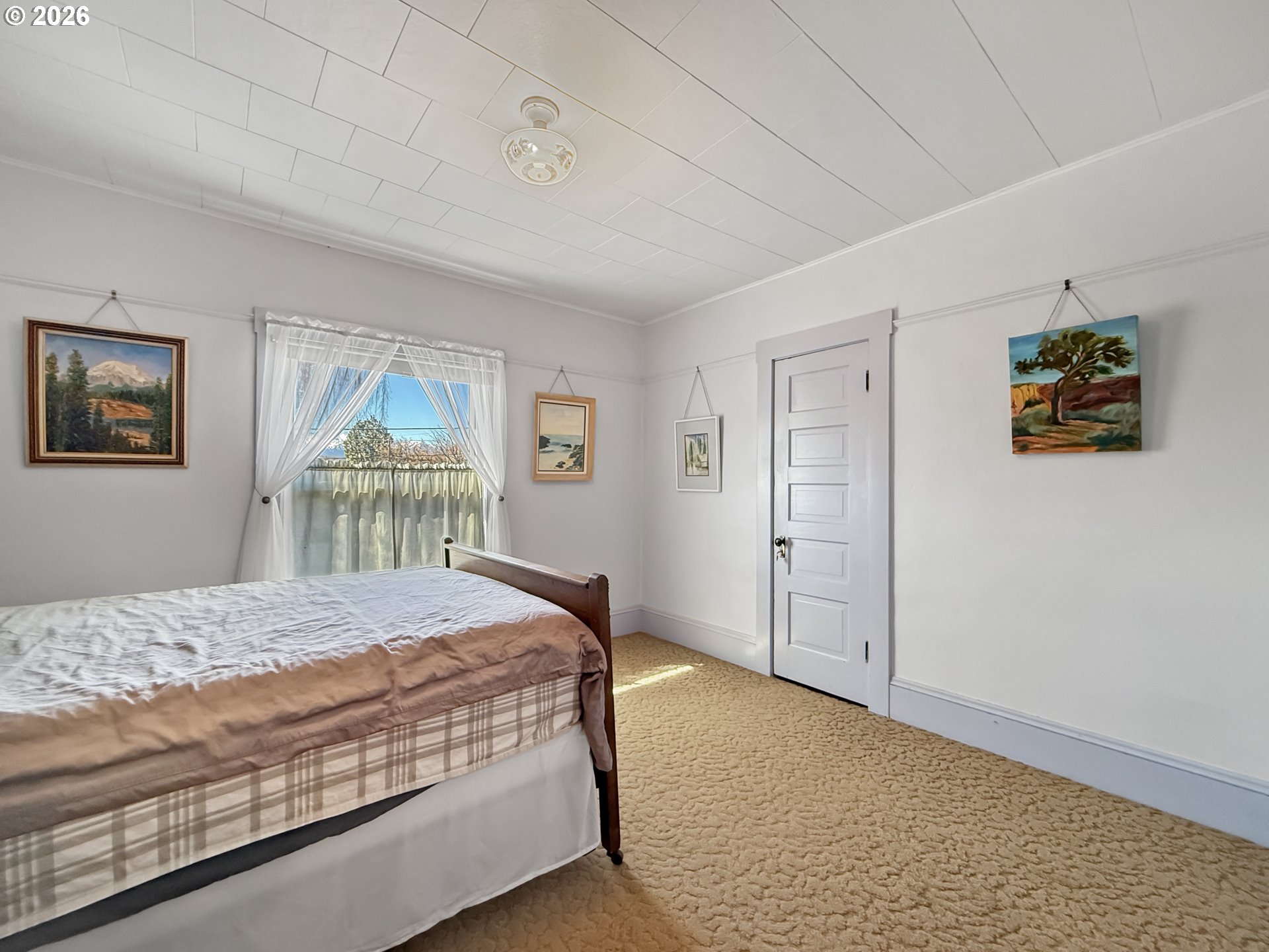 2291 2nd Street Baker City, OR 97814 - Photo 36 of 48 a bedroom with a bed and a window