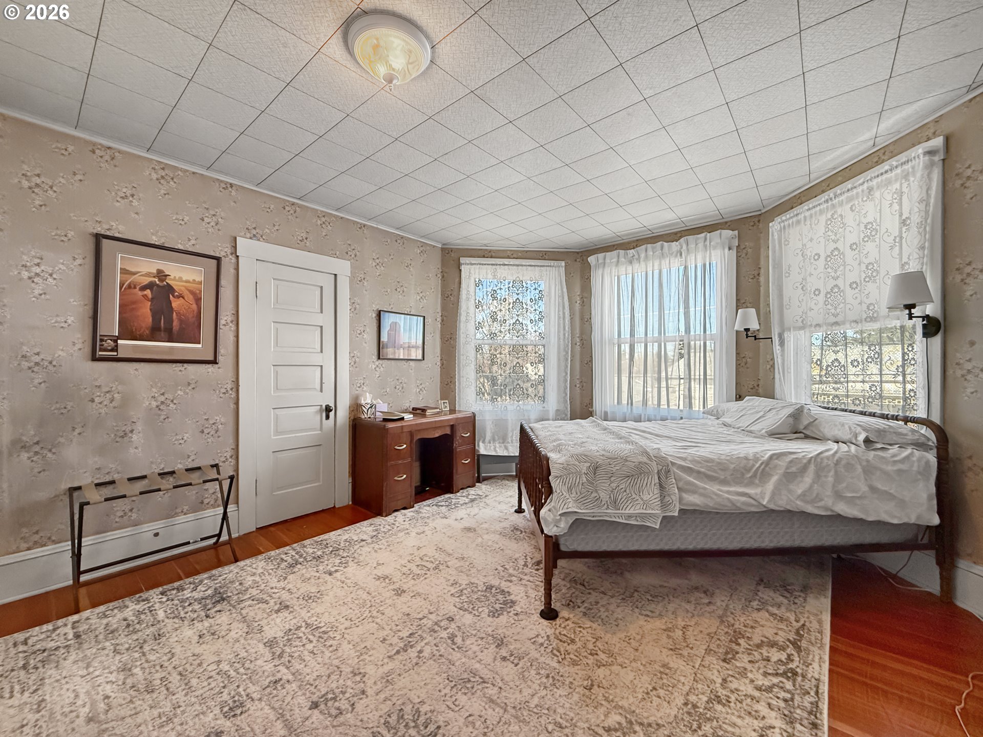 2291 2nd Street Baker City, OR 97814 - Photo 38 of 48 a bedroom with a bed and dresser with mirror