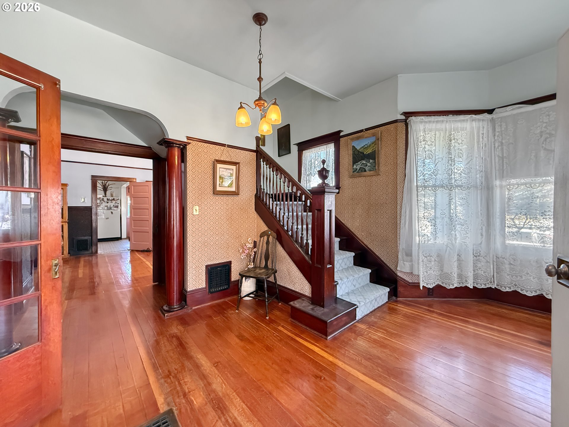 2291 2nd Street Baker City, OR 97814 - Photo 5 of 48 a view of a room with wooden floor staircase and windows