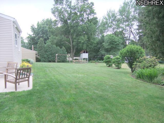 244 Winchester Road Akron, OH 44333 - Photo 19 of 21 Look at this pretty backyard! Features mature landscaping, garden space and nice area for the kids to play.