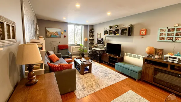 a living room with furniture and a fireplace