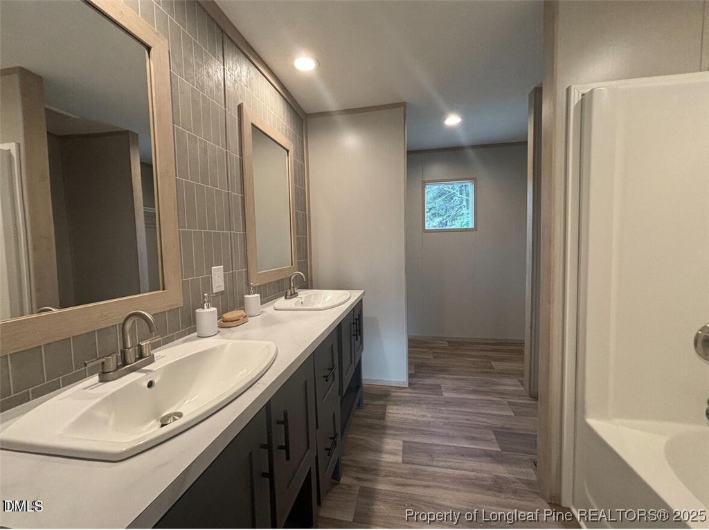 351 Page Road Godwin, NC 28344 - Photo 12 of 19 a bathroom with a double vanity sink and a mirror