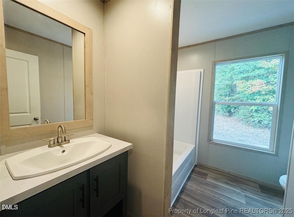 351 Page Road Godwin, NC 28344 - Photo 14 of 19 a bathroom with a sink and a mirror