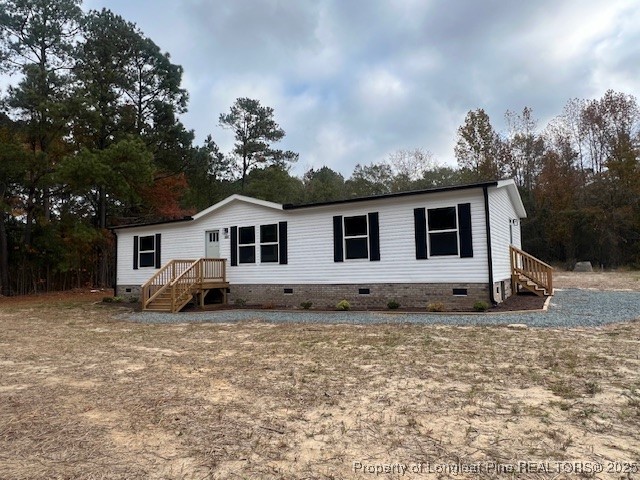 351 Page Road Godwin, NC 28344 - Photo 2 of 19 a view of a white house with a yard