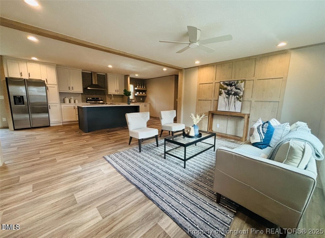 351 Page Road Godwin, NC 28344 - Photo 3 of 19 a living room with furniture and kitchen view