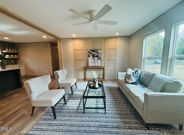 a living room with furniture and a rug