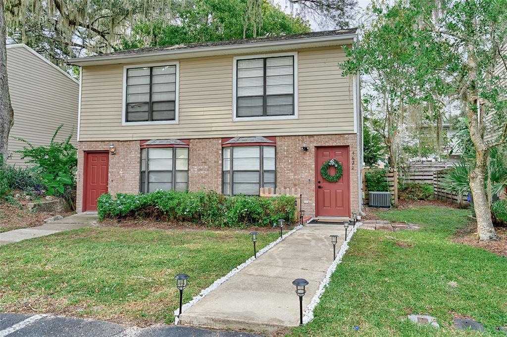 4622 Southwest 45th Lane Gainesville, FL 32608 - Photo 1 of 1 a front view of a house with garden