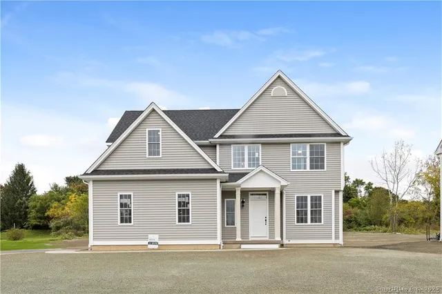a kitchen with stainless steel appliances granite countertop a sink a stove and cabinets