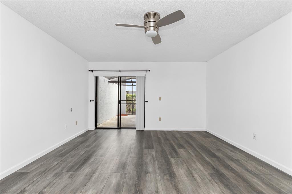 9114 Southwest 20th Street, Unit B Boca Raton, FL 33428 - Photo 17 of 36 wooden floor in an empty room