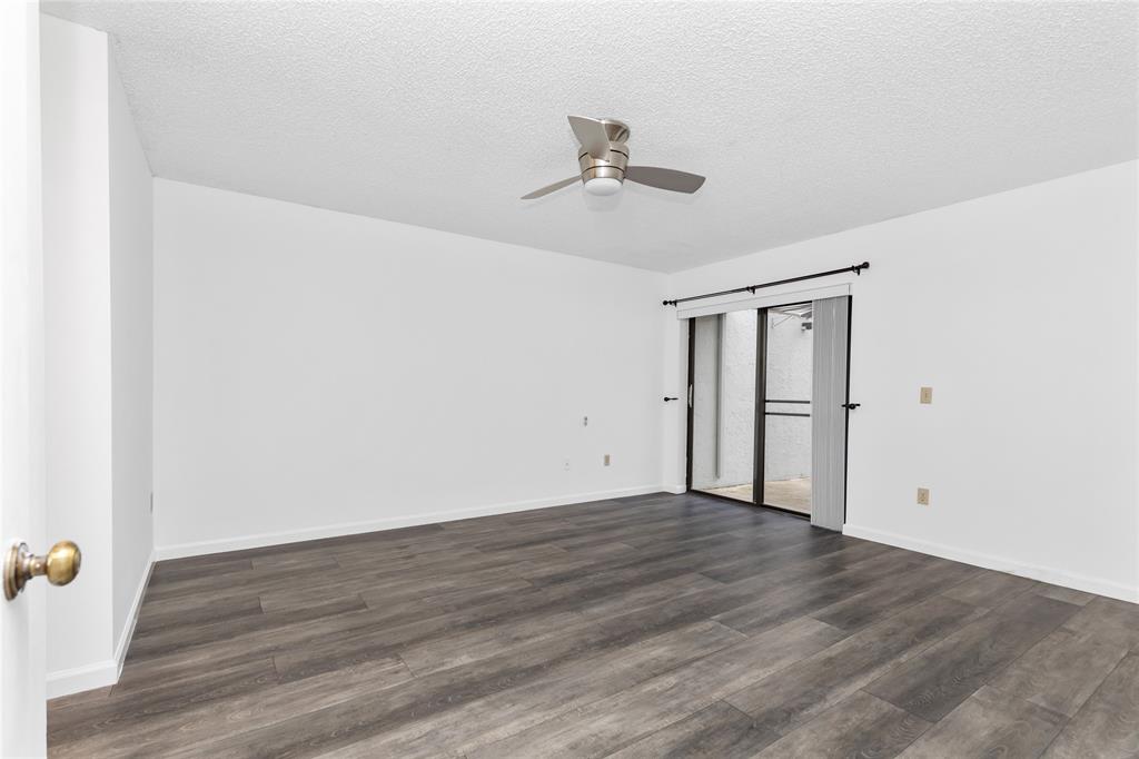 9114 Southwest 20th Street, Unit B Boca Raton, FL 33428 - Photo 18 of 36 wooden floor in an empty room