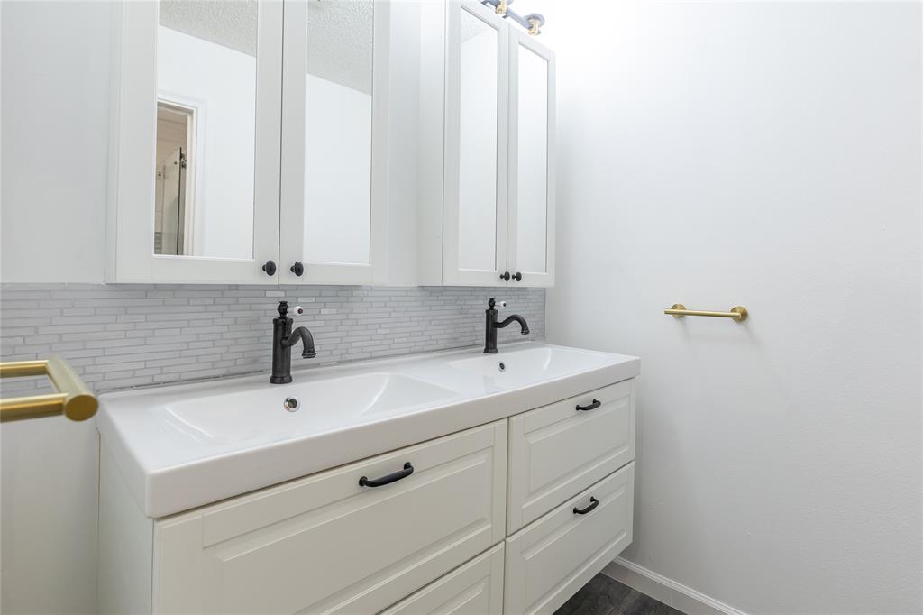 9114 Southwest 20th Street, Unit B Boca Raton, FL 33428 - Photo 20 of 36 a bathroom with a sink and a white cabinet
