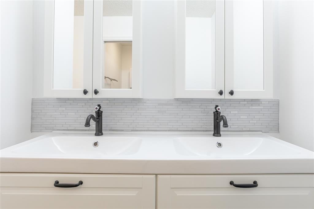 9114 Southwest 20th Street, Unit B Boca Raton, FL 33428 - Photo 21 of 36 a bathroom with a sink and mirror