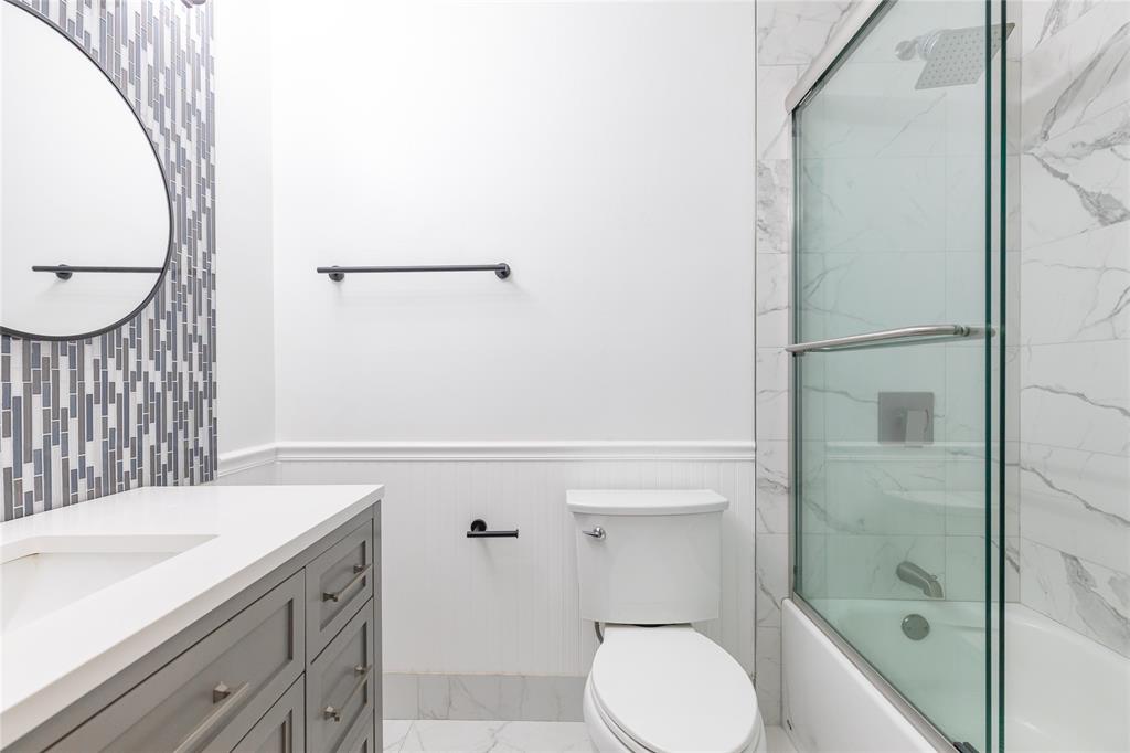 9114 Southwest 20th Street, Unit B Boca Raton, FL 33428 - Photo 25 of 36 a bathroom with a sink a toilet and shower