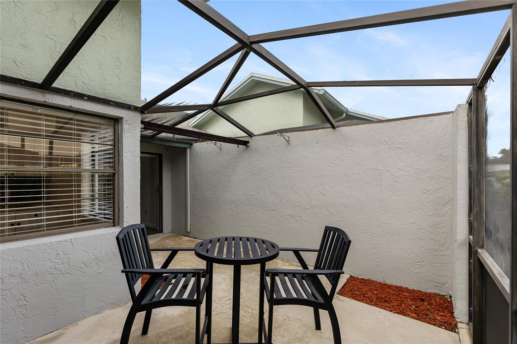 9114 Southwest 20th Street, Unit B Boca Raton, FL 33428 - Photo 27 of 36 a view of a dining room with furniture and a window