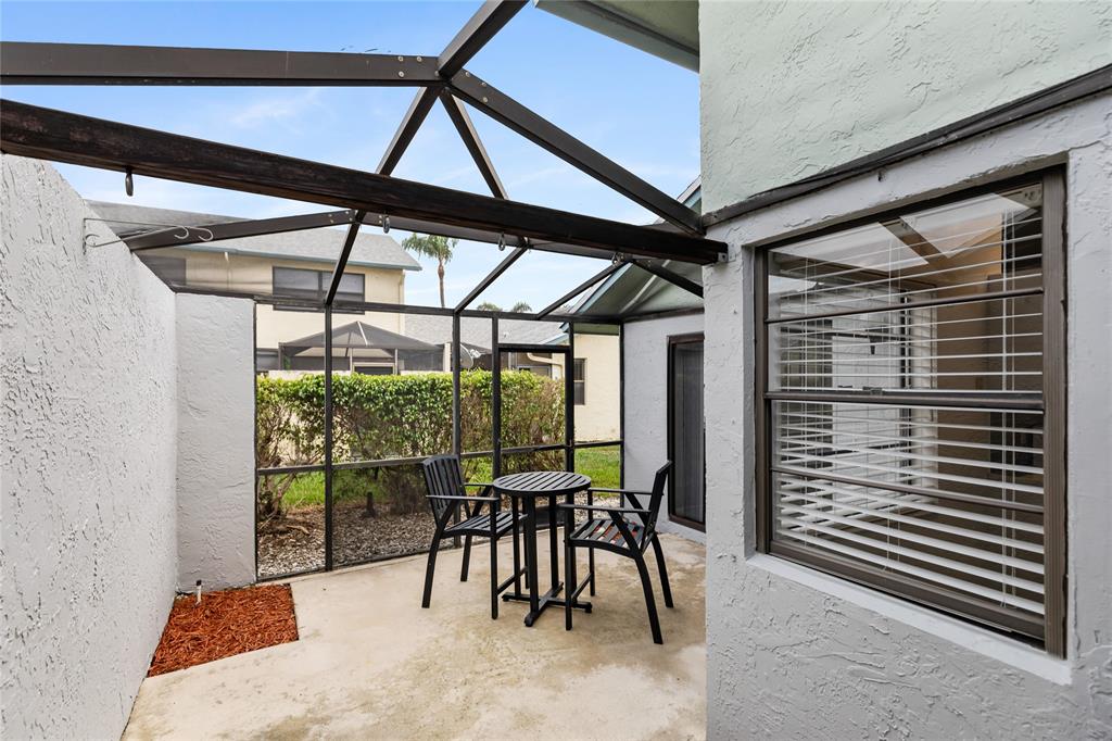 9114 Southwest 20th Street, Unit B Boca Raton, FL 33428 - Photo 29 of 36 a view of a room with furniture and a porch