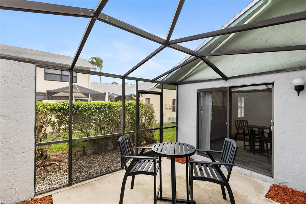 9114 Southwest 20th Street, Unit B Boca Raton, FL 33428 - Photo 30 of 36 a view of a room with furniture and a window