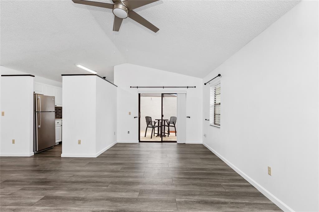 9114 Southwest 20th Street, Unit B Boca Raton, FL 33428 - Photo 10 of 36 a view of empty room with wooden floor and window