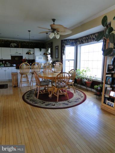 5979 Ketch Road Prince Frederick, MD 20678 - Photo 2 of 11 a living room with furniture and a chandelier