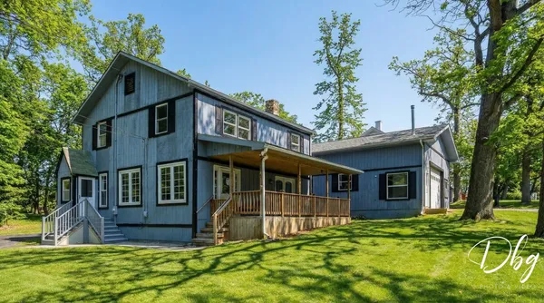 a view of a chairs and table in the balcony