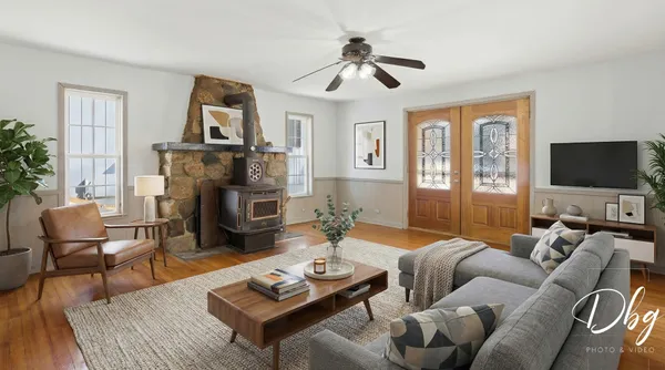 a living room with furniture and a flat screen tv
