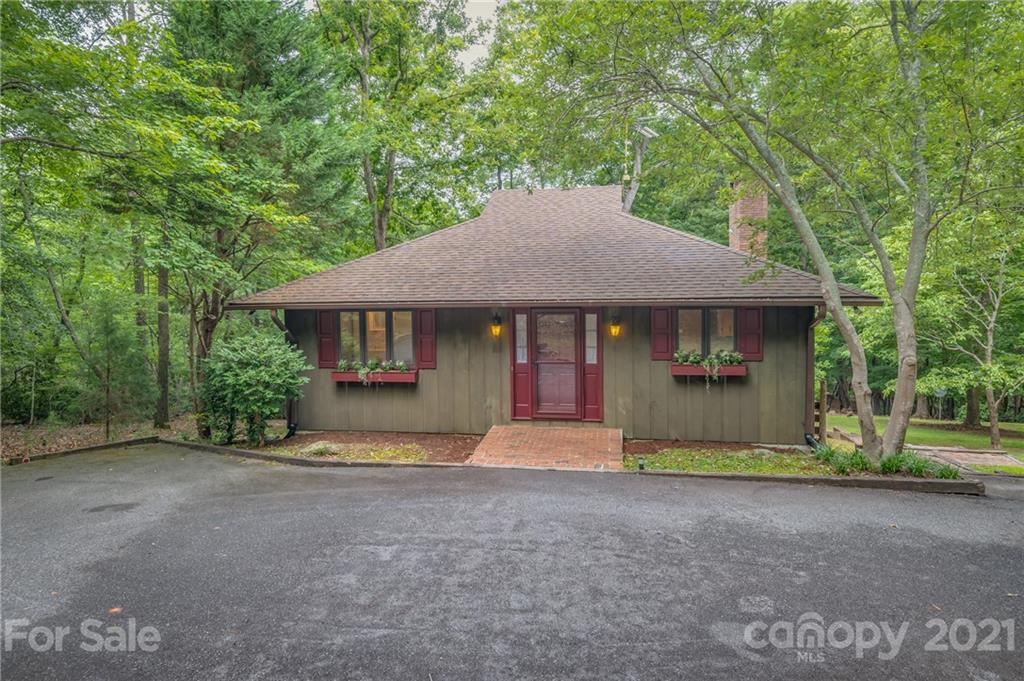 355 Winterset Trail Tryon, NC 28782 - Photo 1 of 22 a front view of a house with a garden