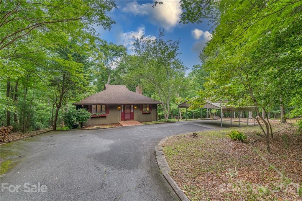 355 Winterset Trail Tryon, NC 28782 - Photo 3 of 22 a view of a house with backyard and sitting area