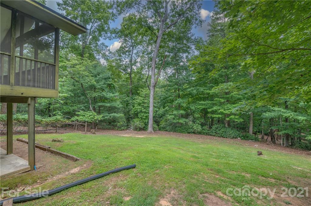 355 Winterset Trail Tryon, NC 28782 - Photo 21 of 22 a view of a backyard with a garden