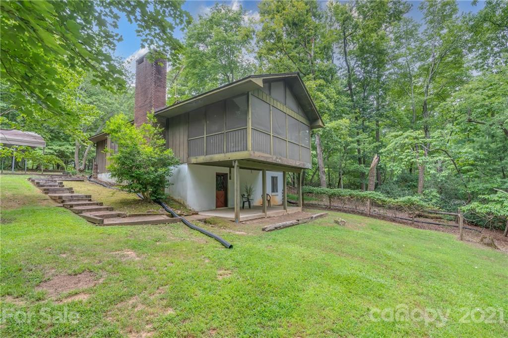 355 Winterset Trail Tryon, NC 28782 - Photo 22 of 22 a view of a chair and table in backyard of the house