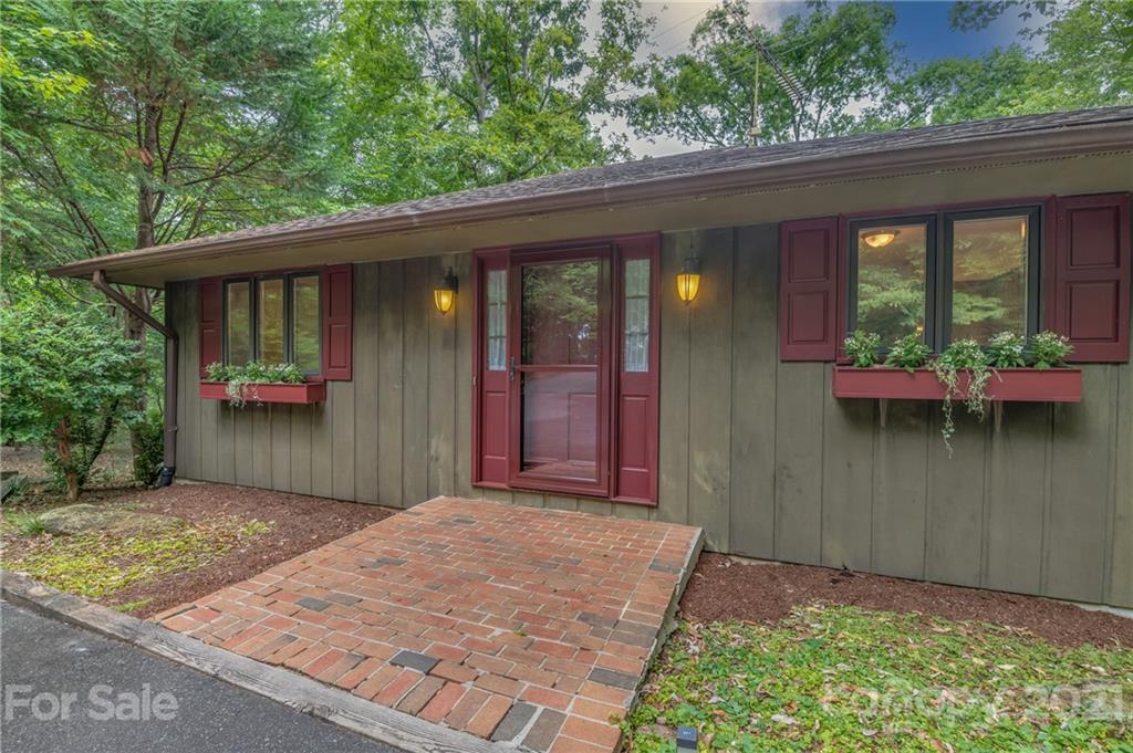 355 Winterset Trail Tryon, NC 28782 - Photo 4 of 22 a front view of a house with garden