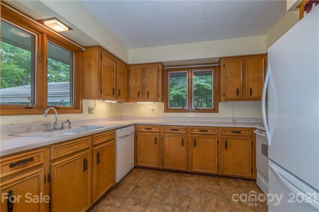 355 Winterset Trail Tryon, NC 28782 - Photo 6 of 22 a kitchen with a sink stove and cabinets