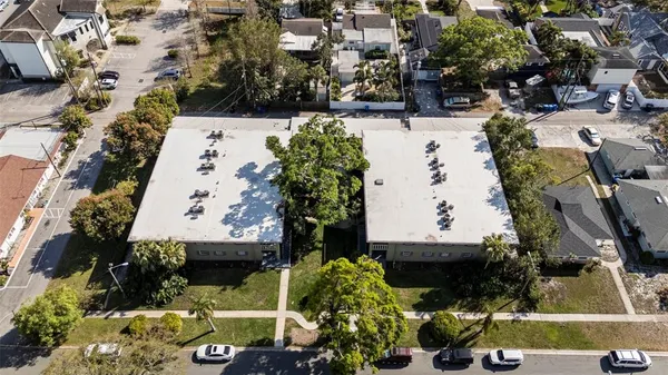 an aerial view of residential houses with outdoor space