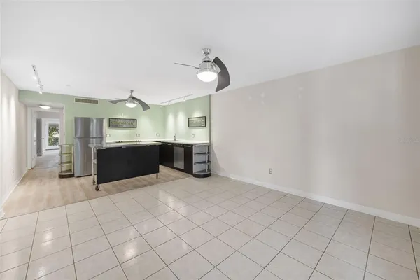 a view of a kitchen with furniture and a sink