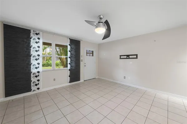 a view of an empty room with a window