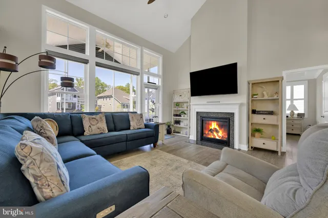 a view of a dining room with furniture and a potted plant