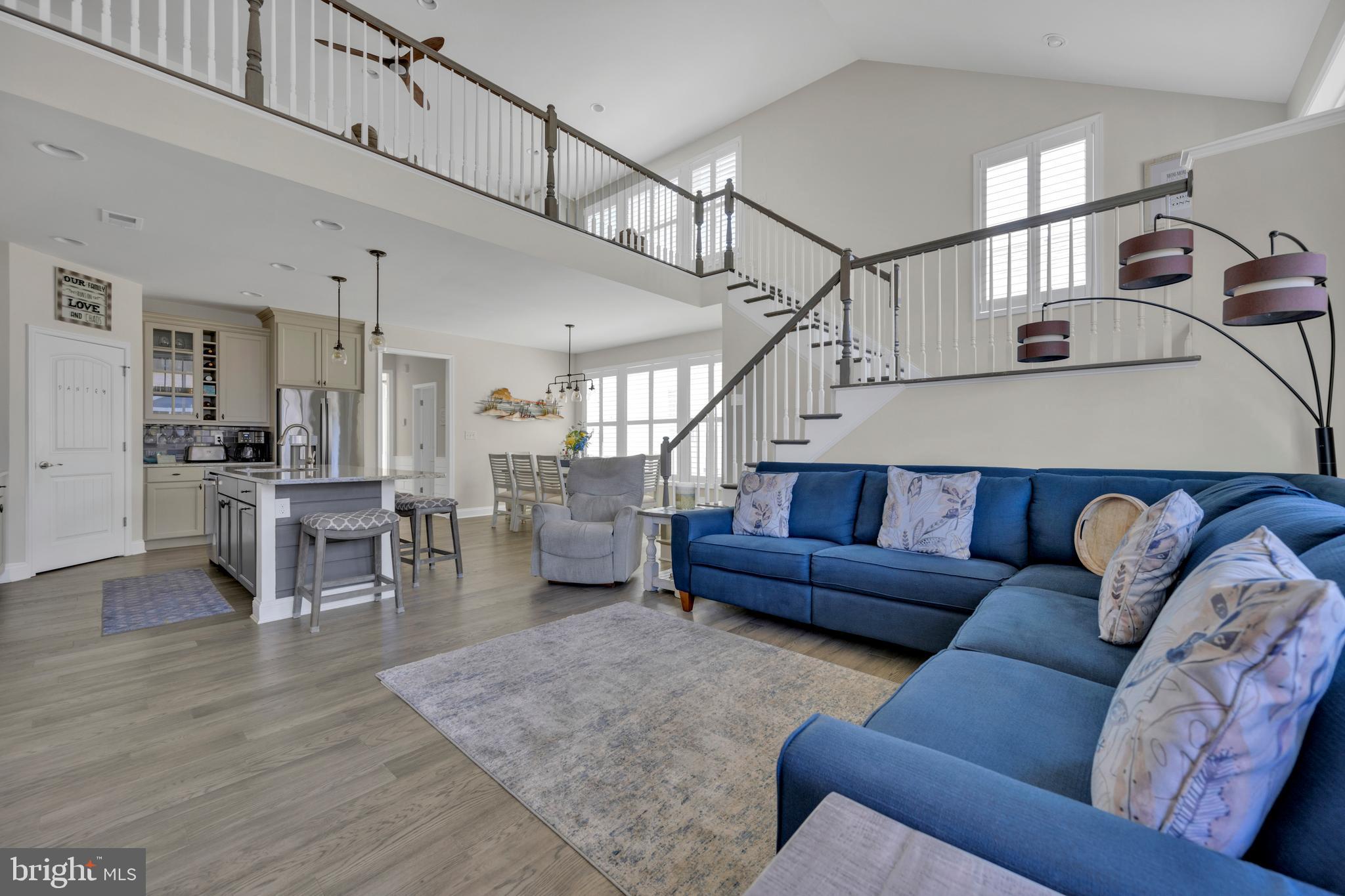 11886 Haslet Road Lewes, DE 19958 - Photo 19 of 60 a living room with furniture and wooden floor