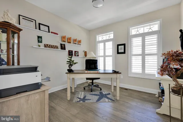 a bathroom with a double vanity sink mirror and shower