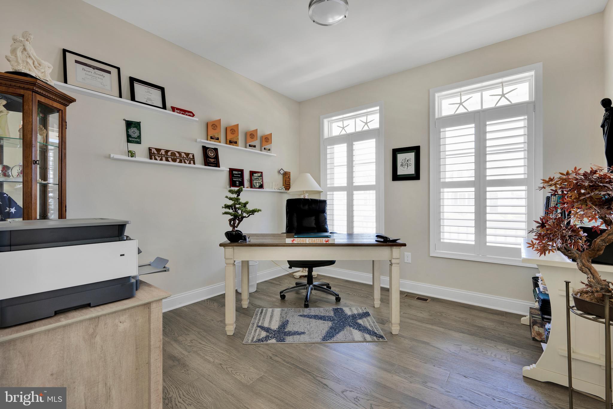 11886 Haslet Road Lewes, DE 19958 - Photo 22 of 60 a workspace with furniture hardwood and a window