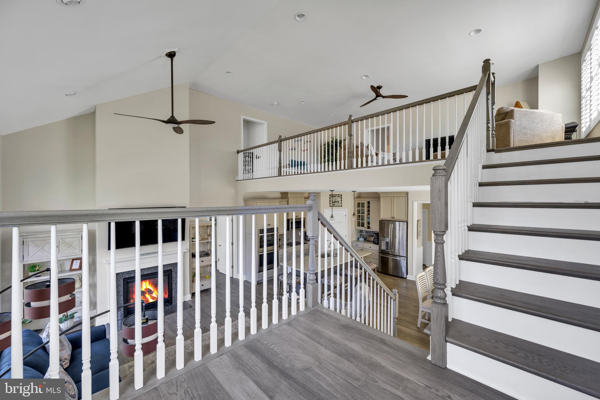 11886 Haslet Road Lewes, DE 19958 - Photo 28 of 60 a view of staircase with white walls and windows
