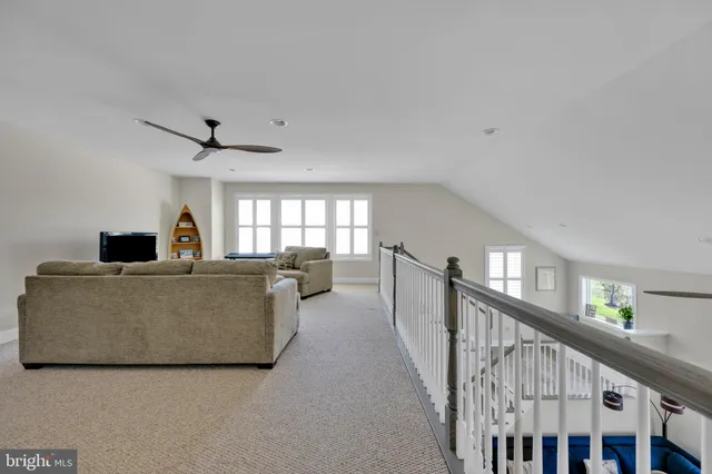 a bathroom with a sink double vanity granite tub and a mirror