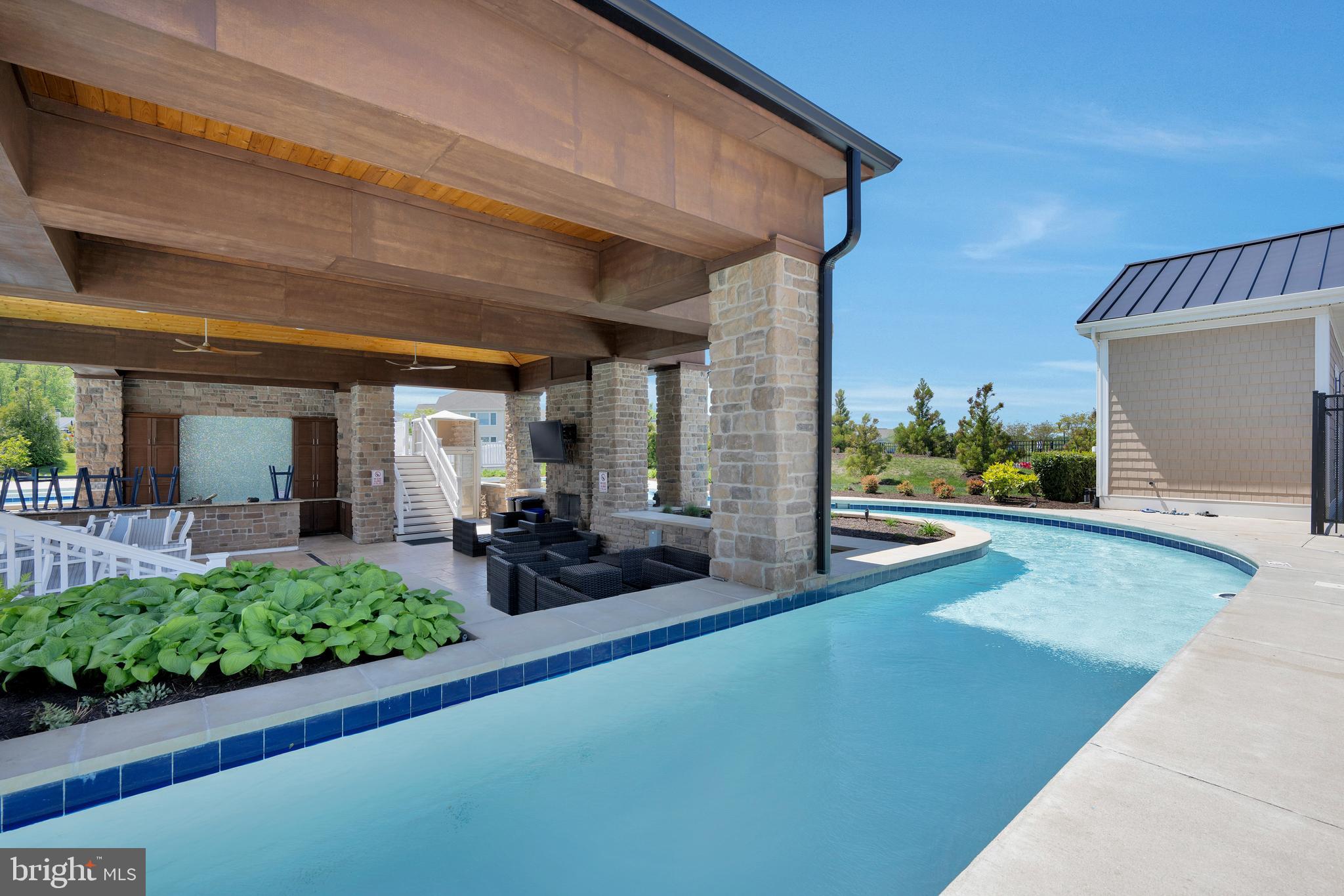 11886 Haslet Road Lewes, DE 19958 - Photo 46 of 60 a view of a house with porch and garden