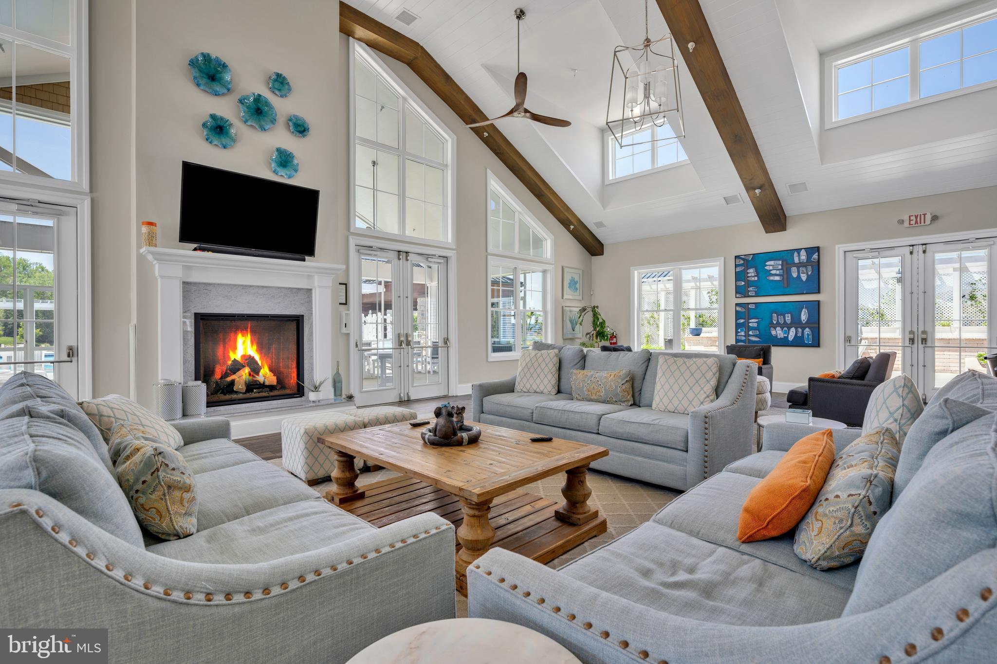 11886 Haslet Road Lewes, DE 19958 - Photo 48 of 60 a living room with furniture fireplace and a flat screen tv