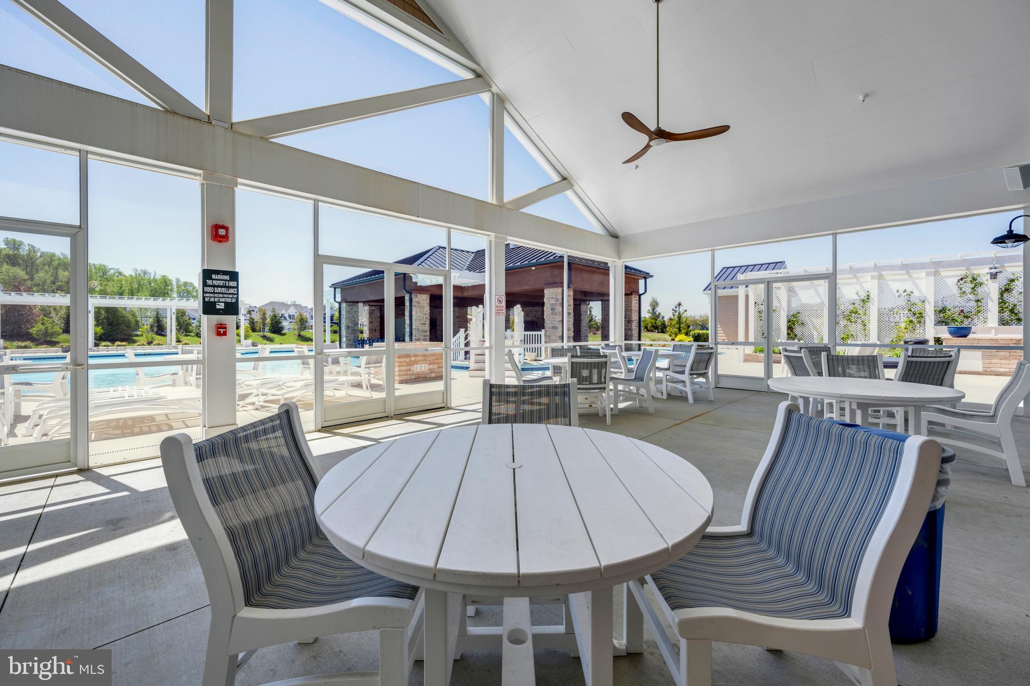 11886 Haslet Road Lewes, DE 19958 - Photo 56 of 60 a view of a dining room with furniture wooden floor and chandelier