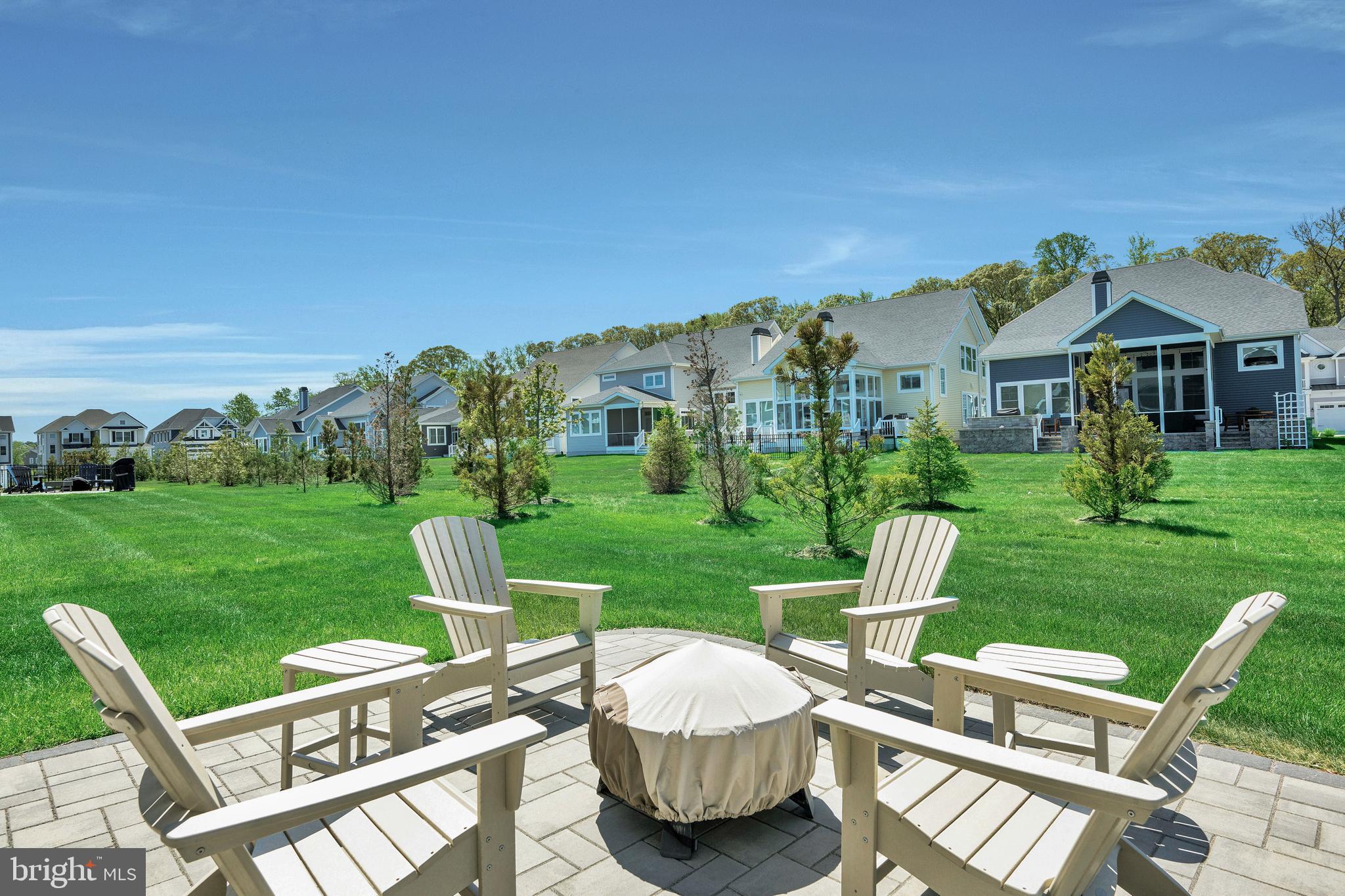 11886 Haslet Road Lewes, DE 19958 - Photo 8 of 60 a view of a chairs and table in backyard of the house