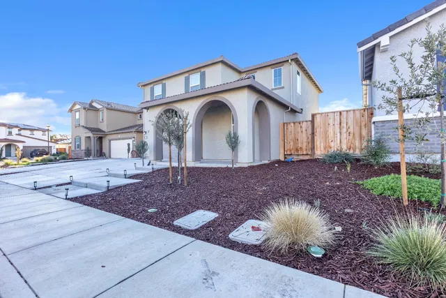 a view of living room with furniture and a clock