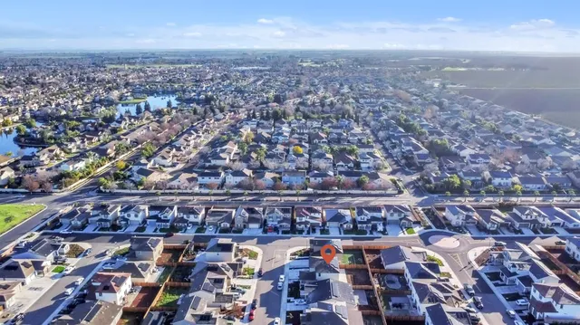 a living room with furniture and large window