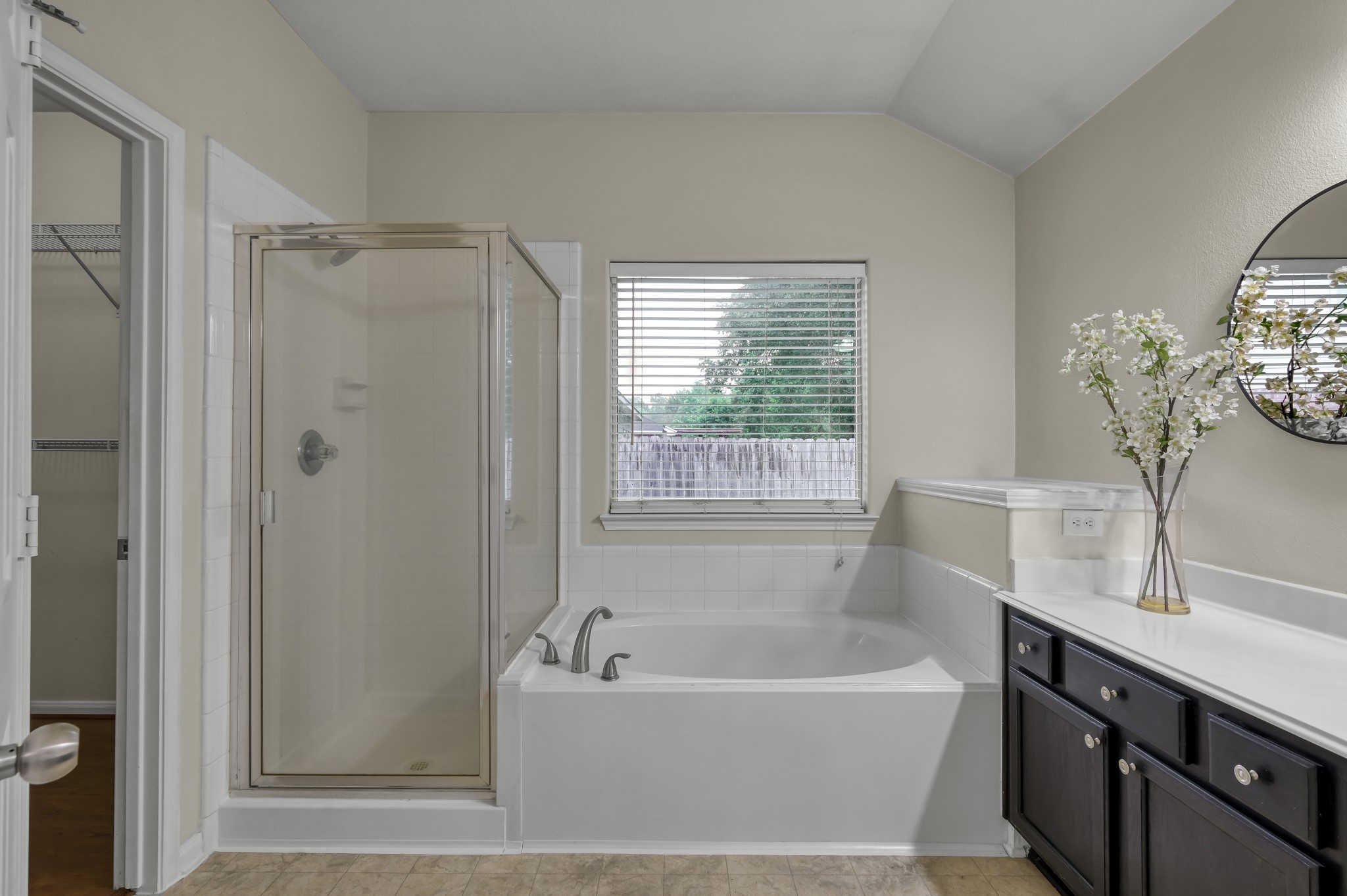 631 Timberstand Lane Spring, TX 77373 - Photo 23 of 38 Enjoy the convenience of a separate tub and shower with plenty of natural light in the private primary bath.