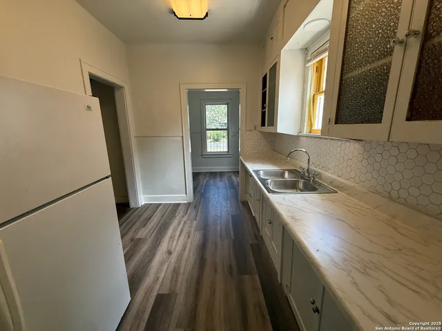 a bathroom with sink a vanity and a mirror